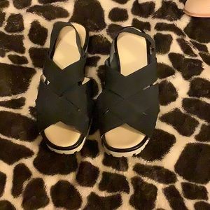 Black material with white wedge heels